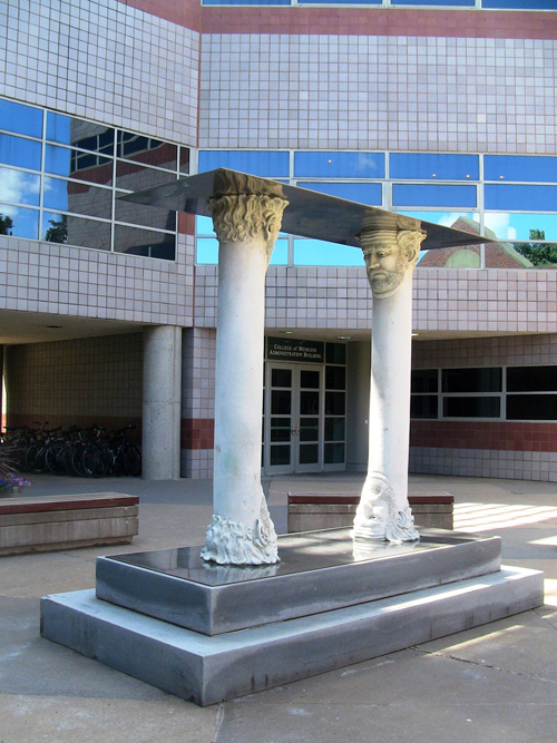 Gateway to Self-Realization, 1992, bronze and stainless steel plates, ed. of 3, 1 A.P., each column: 90 x 23 x 20 inches. Collection of the University of Iowa Museum of Art.